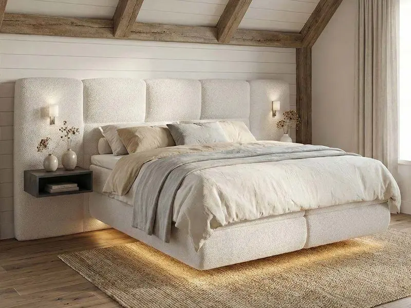 mooi zwevende witte boxspring in landelijke slaapkamer.